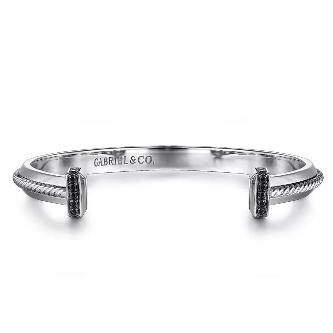 Stylish men's black spinel cuff bracelet with a 7.5 inch diameter.
