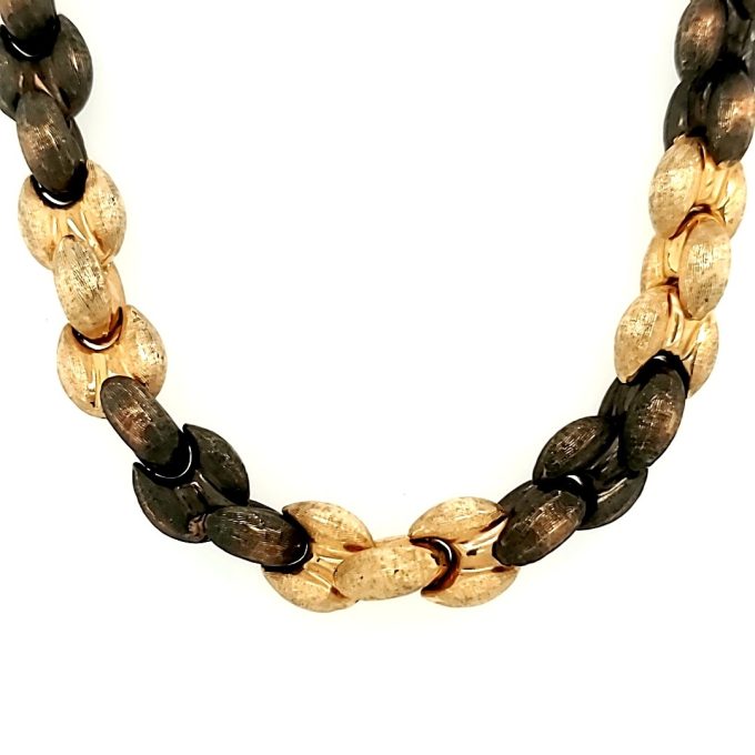Stunning golden necklace with exquisite etching and two-tone chocolate gold finish.
