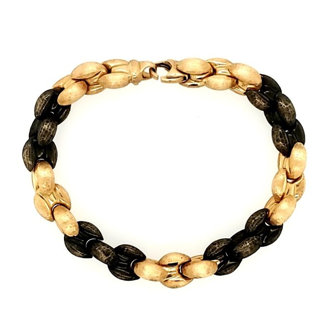 An elegant, two-tone, 18K gold bracelet with beautiful etched details and luster.