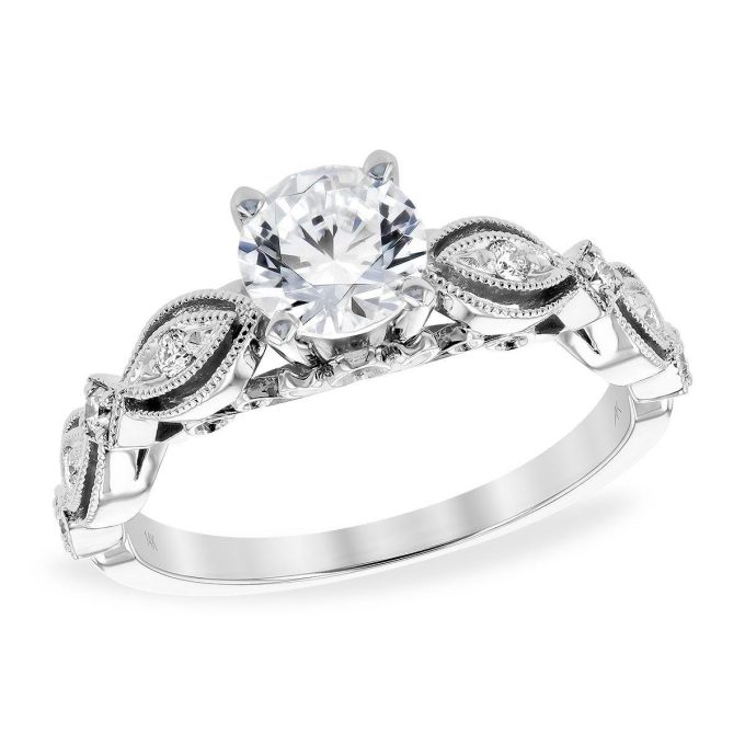 A stunning, vintage-style milgrain engraved ring featuring .59 carats of 14K white gold.