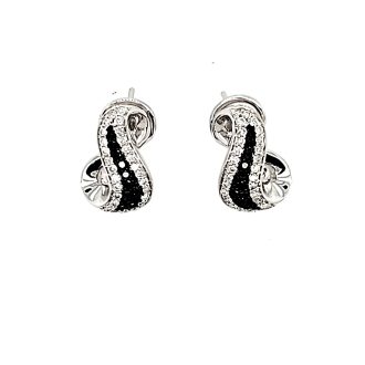 Beautiful 14K white gold infinity drop earrings featuring 0.90 carats of sparkling black and white diamonds.