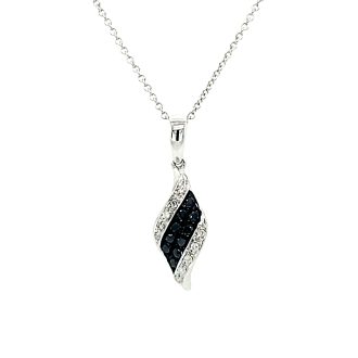 Three rowed swirling drop necklace with 0.26 carats of black and white diamonds on a 14k white gold chain - beautiful and timeless.