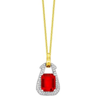 Beautiful sparkly fire opal pendant set in 18k gold shaped like a horseshoe, adorned with 0.30ctw of diamonds.