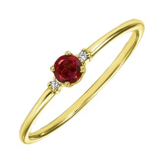 A delicate ruby ring with 14k gold setting, adding a beautiful sparkle to any look.