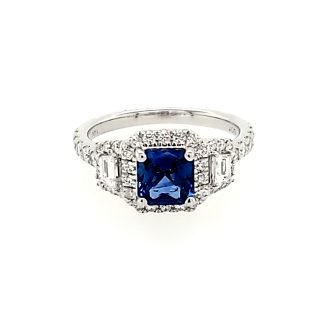Elegant blue sapphire cushion cut halo ring, accented with round diamonds and crafted finely in 14k white gold.