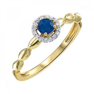Elegant 10 carat sapphire surrounded by diamond halo, set in 10K yellow gold, fashion ring.
