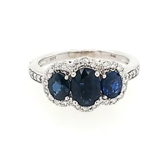 Gleaming 1/3 carat tw blue sapphires, pierced pave' with handcrafted halo setting.