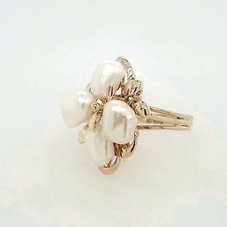 This stunning ring features a 14K gold band crowned with 4 beautiful pearl clusters.