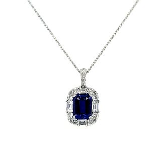 Beautiful 14K white gold halo drop pendant featuring a sparkly 0.5 carat tanzanite surrounded by dazzling diamonds.