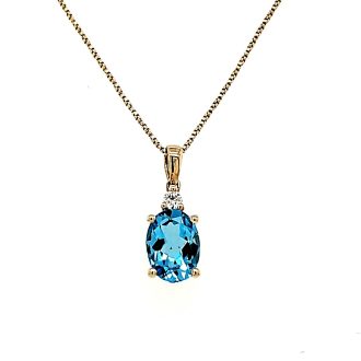 Fashion Necklace with Oval Blue Topaz and .04ctw Round Diamonds in 14k Yellow Gold