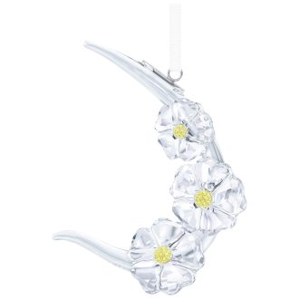 Ornamented with delicate and vibrant wildflowers, this meticulously crafted 2017 collectible adds a touch of elegance to any space. Its dazzling splendor highlights Swarovski's renowned prowess in crystalware artistry, making this eye-catching keepsake a cherished choice for avid collectors. Every detail showcases luxury and precision, suited for gifting or personal collections.