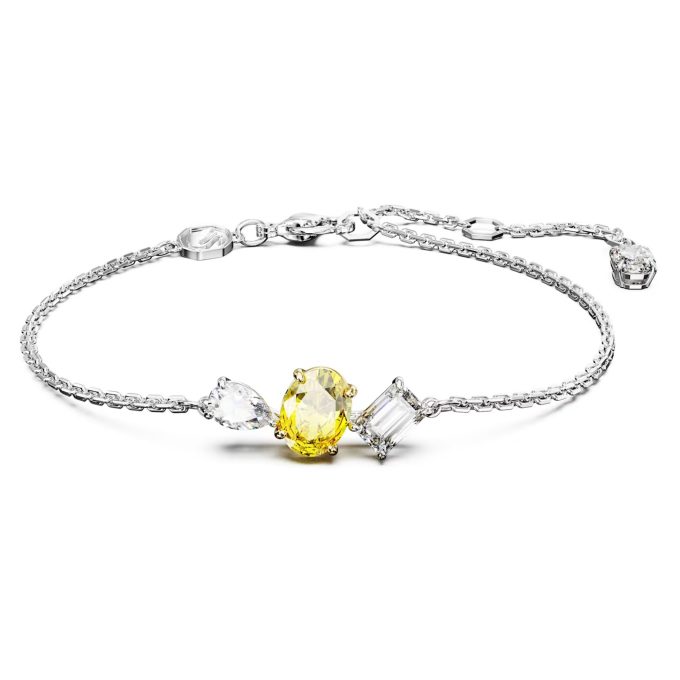 This chic piece caters to all tastes with its colorful combination of yellow and white crystals. Designed with intricacy, the high quality, mixed cut crystals exude sophisticated elegance. Haltered with a durable rolo style bracelet, this ornament is heightened with Rhodium, creating a glamourous piece that elegantly wraps around your wrist.