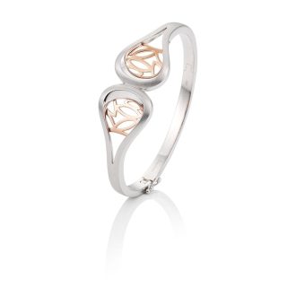 Featuring a blend of satin and rose leaf design, this exquisite cuff bracelet in silver is a luxurious addition to any stylish ensemble. Fixed with an inlay of delicate silver rose leaves, it has an aura fit for anyone who values class and taste. Enchant everyone with this refined piece of ornamental jewellery.