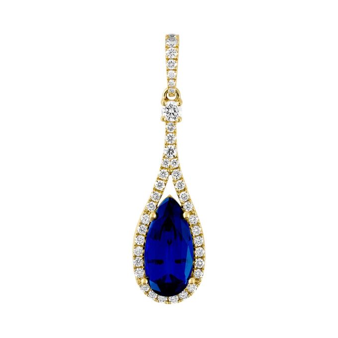 This is a luxurious large blue sapphire pendant, cut in a captivating 12x6 pear shape. The sapphire is encircled by a stunning halo of round diamonds, totaling .38 carats. The pendant elegantly dangles from a 14 karat yellow gold chain to create a mesmerizing drop effect that augments its beauty.