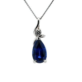 This elegant pendant features a pear-shaped chaton cut sapphire as the centerpiece. The gemstone, dropping from a 12x7 round diamond (0.08ct), adds sophisticated charm. The pendant comes with a chain, making it a stunning piece ready to be worn on special occasions.