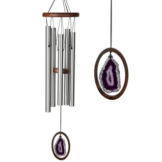 Behold a large, enchanting wind chime adorned with polished agate pieces in radiant hues of purple. The calming, melodious notes produced by the chime fill any space with serenity. Perfect for outdoor or indoor use, this beauty adds a sense of tranquility while enhancing the aesthetic appeal of your environment.