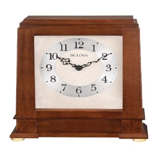 This elegant timepiece exhibits a rich walnut finish, adding a sophisticated touch to your mantle. It features a finely crafted exterior with detailed embellishments, while the striking chimes provide a melodic hourly reminder. This clock merges both aesthetics and functionality seamlessly, becoming a centerpiece of any room décor.