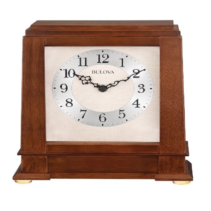 This elegant timepiece exhibits a rich walnut finish, adding a sophisticated touch to your mantle. It features a finely crafted exterior with detailed embellishments, while the striking chimes provide a melodic hourly reminder. This clock merges both aesthetics and functionality seamlessly, becoming a centerpiece of any room décor.