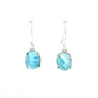 Experience the beauty of these elegant and charming earrings. Exquisitely crafted with sterling silver, they dangle gracefully, featuring 4-prong-set oval-shaped Larimar stones. Their breathtaking blue tone reflects with a captivating allure, adding a subtle tropical vibe to any ensemble. Timelessly sophisticated, these earrings make a sparkling addition to your jewelry collection.