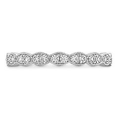 This splendid wedding band features 18 elegant round-cut diamonds arranged in a Lorelei floral pattern. Boasting a total diamond weight of 0.23 carats, the band is expertly crafted from 18k white gold. Further enhancing the design, intricate milgrain detailing adds timeless appeal, making it an exquisite symbol of lasting love.
