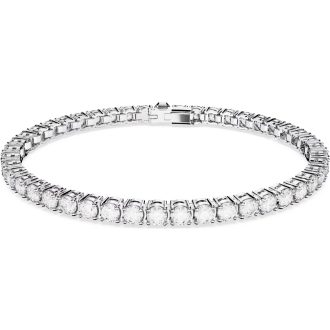 Discover timeless elegance with this sophisticated tennis bracelet. It features dazzling white round crystals, compactly arranged in a continuous row. The 7" bracelet is expertly crafted and seamlessly bezel set in a rhodium-plated metal, adding to its lustrous appeal. This piece flawlessly showcases the high-quality craftsmanship typical of the SWAR jewelry line.