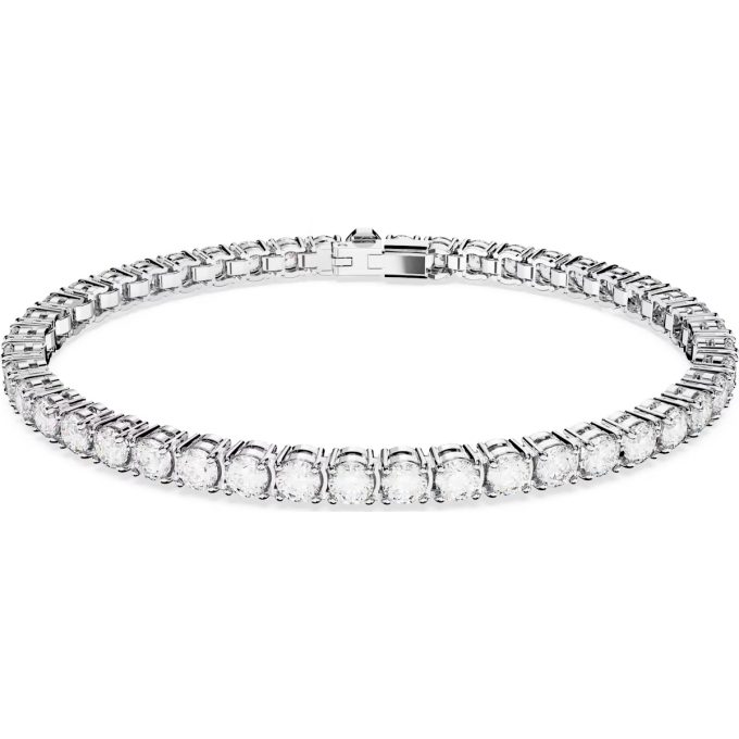 Discover timeless elegance with this sophisticated tennis bracelet. It features dazzling white round crystals, compactly arranged in a continuous row. The 7" bracelet is expertly crafted and seamlessly bezel set in a rhodium-plated metal, adding to its lustrous appeal. This piece flawlessly showcases the high-quality craftsmanship typical of the SWAR jewelry line.