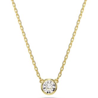 This eye-catching pendant showcases an exquisite white, round cut stone. Set in gold-tone plated metal, it features an equisite design that captures and reflects light, ensuring you a dazzling sparkle wherever you go. The Imber pendant offers a delicate yet striking addition to any jewelry collection, making it a striking gift option or elegant personal treat.