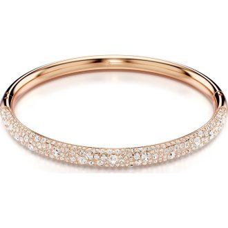 Adorn yourself with the exquisite elegance of this Rose Gold-tone plated adornment. It flaunts a captivating white snow pavA, illuminating the light and exuding luxury. With its inspiration drawn from the spectacular Meteora rock formations, this fashionable piece is certainly attention-catching, making it an ultimate must-have statement bangle.