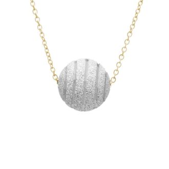 This beautiful, timeless piece features a 12mm gold sphere pendant lightly dusted with intricate vertical stripes. The pendant hangs from an adjustable 16-18" chain, offering versatile wear. Crafted with attention to detail from 14 carat two-tone gold, this jewelry piece gracefully complements any modern ensemble.