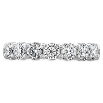 This elegant band is crafted from 18 karat white gold and features nine round signature-cut diamonds with a total weight of nearly half a carat. Renowned for their exceptional quality, the diamonds are classified as GH in colour and VS-SI in clarity, making them a stunning choice for any occasion.