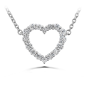 This delicate piece showcases a signature heart pendant with 16 brilliant round cut Hearts on Fire diamonds, totaling 0.39 carat weight. It's expertly crafted from 18 karat white gold and extends from an elegant 18-inch chain, making it a stunning addition to any jewelry collection.