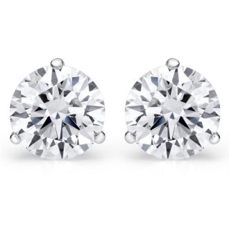 These elegant stud earrings showcase two large, 1.00 carat total weight round-cut diamonds of GH color and VVS2 clarity. Securely held with four prongs, these sparklers sit in position with grace on the 14 karat white gold setting, encourting light to ultimate sparkle from all angles, perfect for adding a touch of luxury to any outfit.