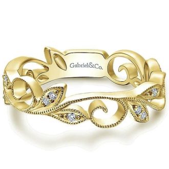 Beautiful 14K yellow gold milgrain stack band with 0.09 carat total weight of diamonds in a delicate leaf pattern.