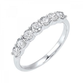 This exquisite piece features seven round cut diamonds, collectively weighing 0.75 carats. Beautifully accommodated in a 14 karat white gold setting, this 7-stone band emanates a radiant glow. Luxurious and timeless, this meticulously crafted band adds spades of charm and an embodiment of elegance. This stunning band will certainly turn heads with its unhindered sparkle.