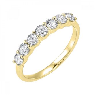 Delicate yet stunning, this band sparkles with seven round-cut stones totaling a quarter-carat weight. Adorned in brilliant 14 karat yellow gold, it offers an elegant statement for everyday wear or special occasion. The timeless7-stone design illustrates both luxury and classic beauty guaranteed to enhance any jewelry collection.