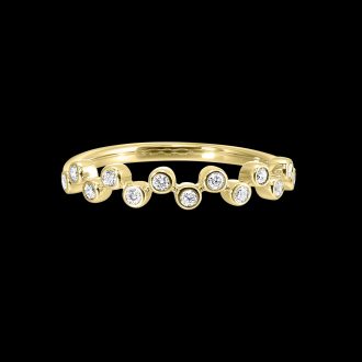 Indulge in ultimate luxury with this meticulously crafted showpiece. Showcasing 13 round bezel-set diamonds equating to 1/5 carats, this divine ring is fashioned from 14-karat yellow gold. Its unique offset diamond design boasts elegance making it the perfect choice for stacking or minimalist attire that demands a touch of glamour.