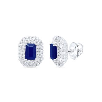 These earrings are finished in robust 14 karat white gold, highlighting elegantly cut Emerald-style 6x4 sapphires at the center. The sapphires are beautifully encircled by two halo rows with a diamond weight of half a carat. Together, the sapphires and diamonds make these stud earrings a spectacular add-on to any jewelry collection.