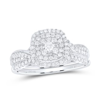 This exquisite engagement ring set is beautifully crafted in 14 karat white gold. The distinctive feature is the stunning triple cushion halo setting that envelopes the prime round diamond. Half a carat total weight of luminescent diamonds are delicately placed along the twisted shank design for a timeless, elegant look.