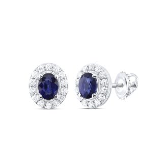 These elegant stud earrings feature stunning 4x3mm oval blue sapphires, framed by shimmering diamond halos. Crafted in 14 karat white gold to draw out the vibrant blue hues; nice and secure on the ears. Each diamond totals 0.125 carats, combining a subtle glimmer with the eye-catching blue of the sapphires.