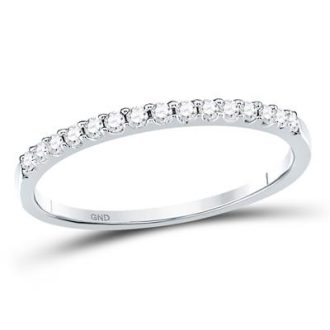 Adorn your finger with this thin prong 14 Karat solid white gold band. It's beautifully set with round cut diamonds totaling a carat weight of 0.16. Perfect as a gift or a personal treat, offering delicate sparkle. Can be resized to a size 7 if needed. Ideal for those who appreciate minimalist elegance.