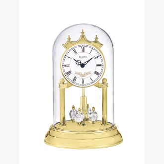 Commemorate your anniversary with "Heather." This luxurious mantlepiece features a stunning clock encased in an elegant glass dome. High quality golden tones accent the intricate detailing within the clock face. A striking celebration of timeless love, its refined design enhances any living space, reminding you of your precious moments each time you glance at it.