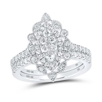 This splendid Nicole Wedding set boasts a romantic vintage design featuring a marquise-cut centerpiece haloed by round, clustered 1.00CTW diamonds. Embodying timeless elegance, the set is crafted from durable and precious 10 karat white gold, bringing rich luster and captivating shine for a lifetime.