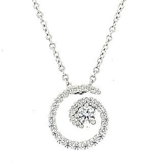 This elegant pendant flaunts a modern spiral design, comprised of 28 pristine round diamonds, confidently weighing 0.36 carats. Held in 18 karat white gold, it is a majestic part of the Hearts of Fire collection. Mystery and beauty aligned to creating a high-end statement piece for all precious moments of your life.