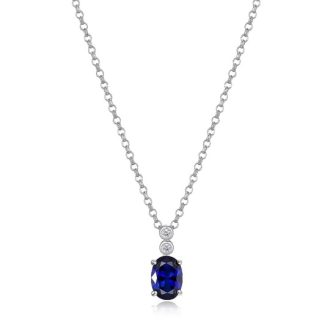 This stunning sapphire pendant necklace features two large diamonds with a total carat weight of 0.02. The deep blue sapphire is framed in a classic setting and hangs from an 18" chain. Perfect for adding a touch of sparkle to your look.