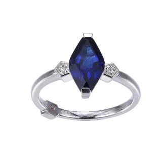 This is an exquisite fashion ring, beautifully set with large diamonds and an elongated marquise cut sapphire centerpiece, all encased in rhodium-plated sterling silver for extra shine and durability. Perfect for those who adore sophisticated and eye-catching jewelry and want to exude elegance and luxury on any occasion.