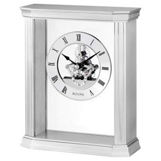 This antique-styled tabletop timepiece dazzles with a polished metallic finish. The intriguing skeleton design reveals intricate inner gears, marrying functionality and art. It provides the time in silver Roman numeral indices, showcasing its wealth of detail and complementing modern and traditional interiors alike. A time pronouncing affluence and taste.
