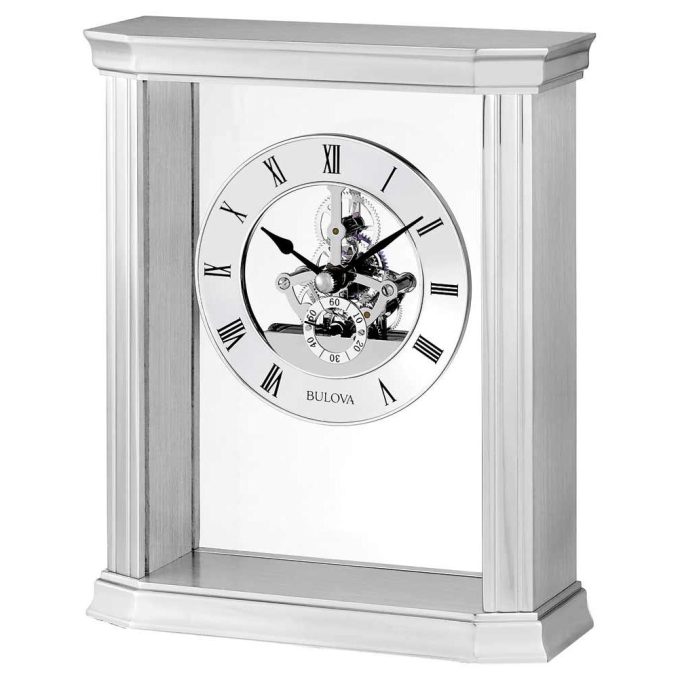 This antique-styled tabletop timepiece dazzles with a polished metallic finish. The intriguing skeleton design reveals intricate inner gears, marrying functionality and art. It provides the time in silver Roman numeral indices, showcasing its wealth of detail and complementing modern and traditional interiors alike. A time pronouncing affluence and taste.