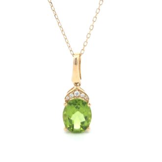 Oval Peridot Pendant with .04ctw Round Diamonds in 14k Yellow Gold