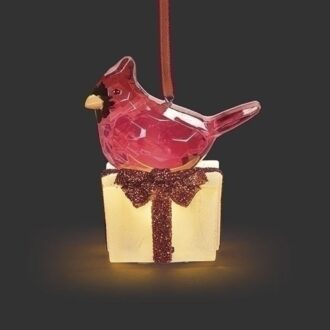 Illuminate your holiday decor with this charming 2.5" Lighted Cardinal Ornament on a frosted gift. Perfect for adding a touch of seasonal cheer to your tree or festive displays, it's a delightful accent piece that embodies the spirit of winter wonder. A must-have for holiday enthusiasts and bird lovers alike