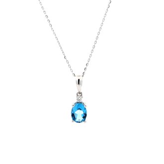 Oval Blue Topaz and .04ct Round Diamonds in 14k White Gold Pendant